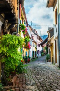 Traditional french houses and shops in Eguisheim, Alsace, France